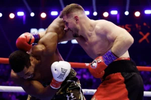 Joshua bị đánh ngã sau 20 giây vẫn thắng knock-out